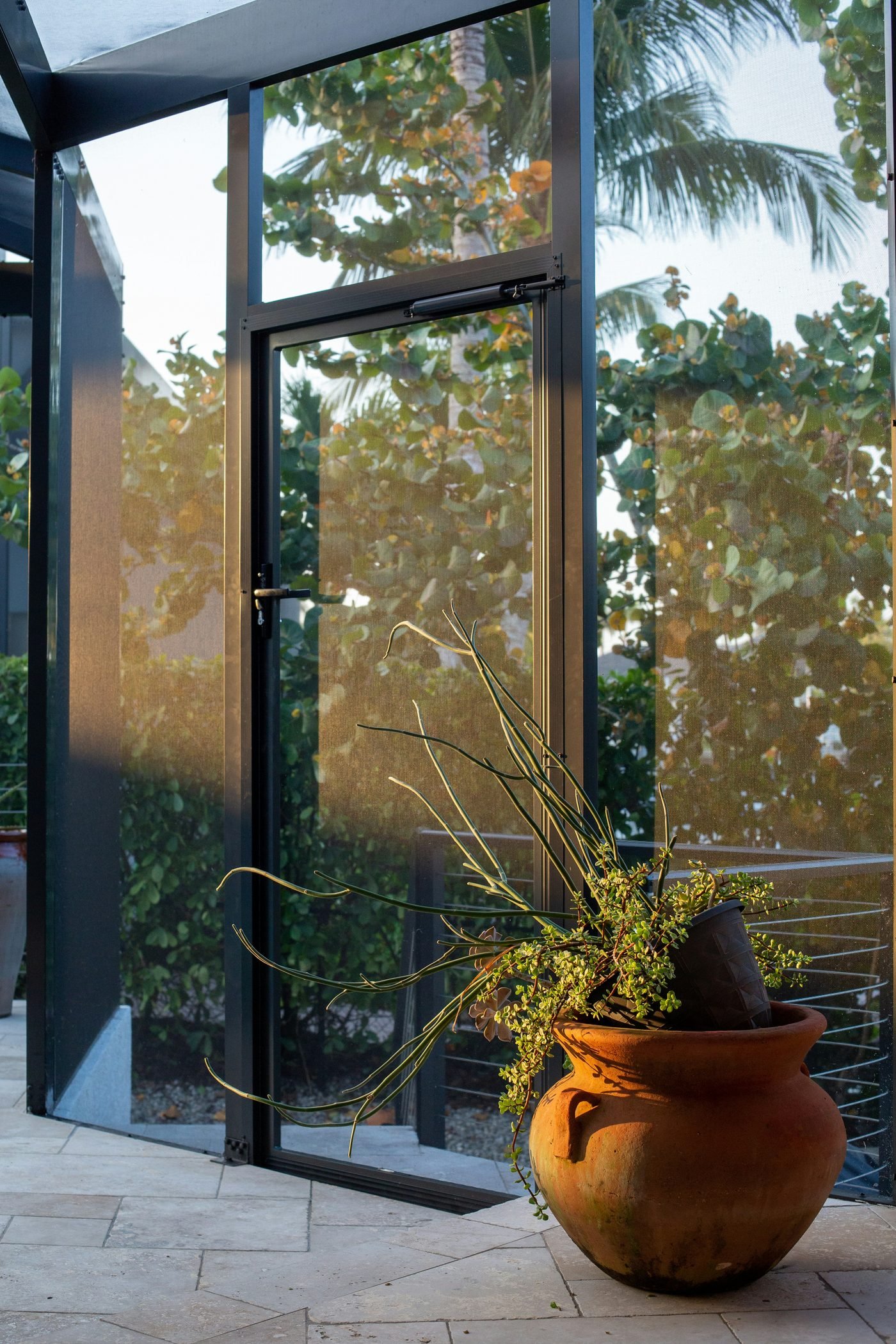 Soglia aluminium French doors opening onto a terrace